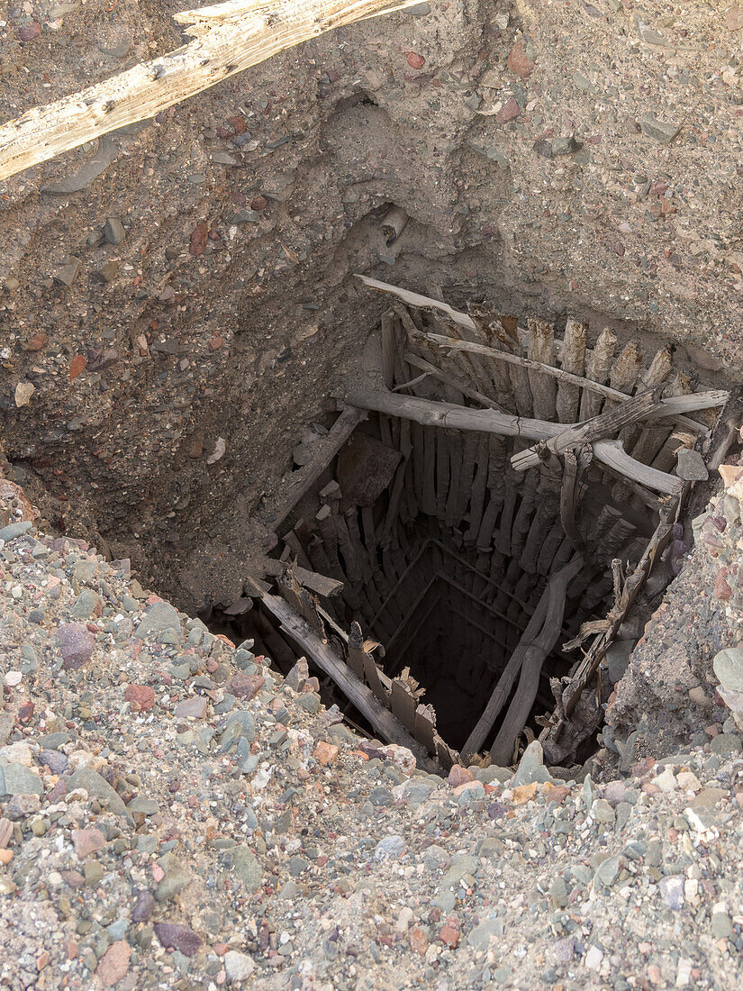 Vertical shaft of an abandoned silver mine from the 1800s in the area of the Hill of Seven Colors near Calingasta, Argentina.