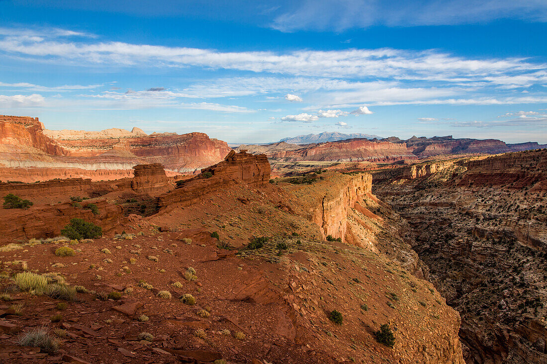 Sunset light on the formations of Capitol Reef National Park, viewed from Sunset Point on the edge of Sulpur Creek Canyon.