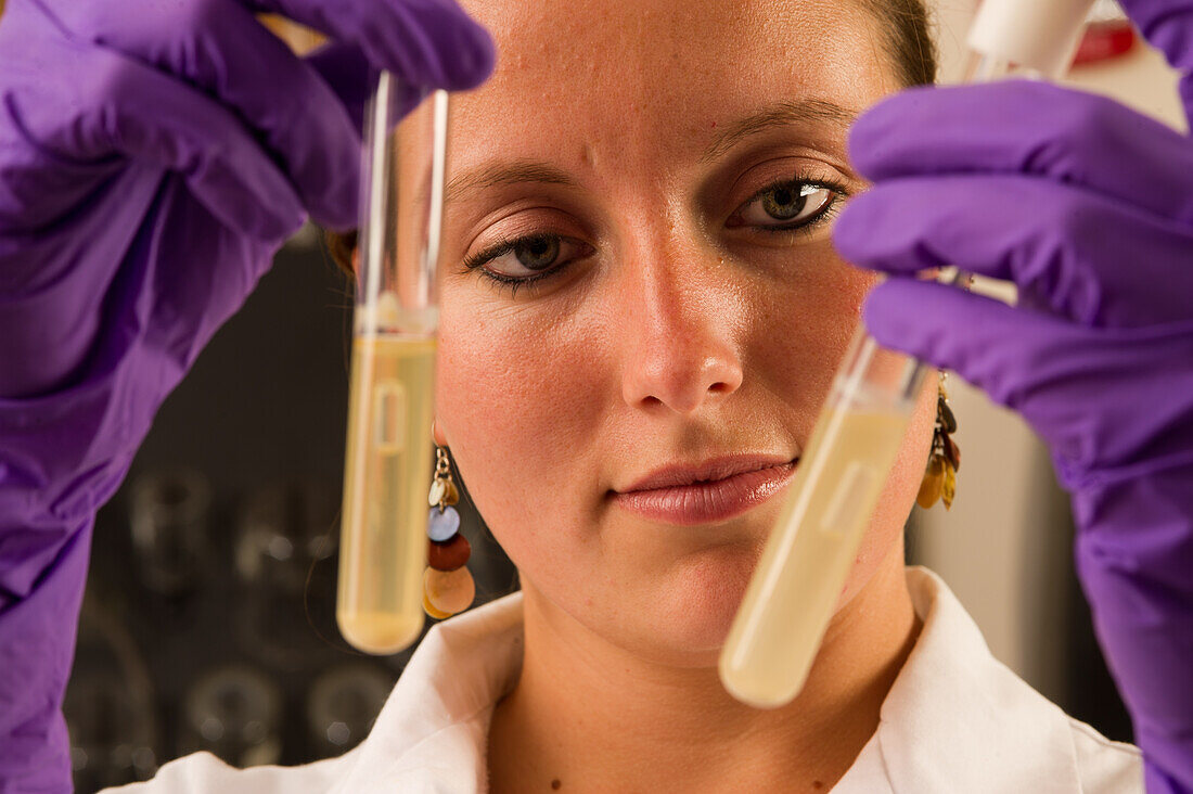 Woman with an experiment in a food lab