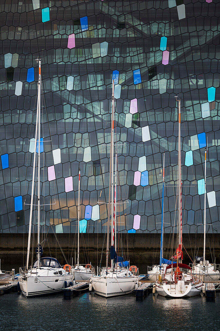 Harpa Concert Hall and Conference Centre and boats in Reykjavik Harbour, Iceland