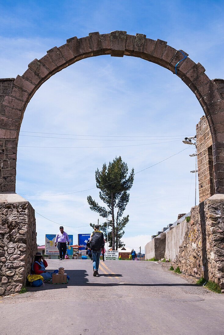 Walking across the Peru Bolivia border crossing at Lake Titicaca, from Puno in Peru to Copacabana in Bolivia