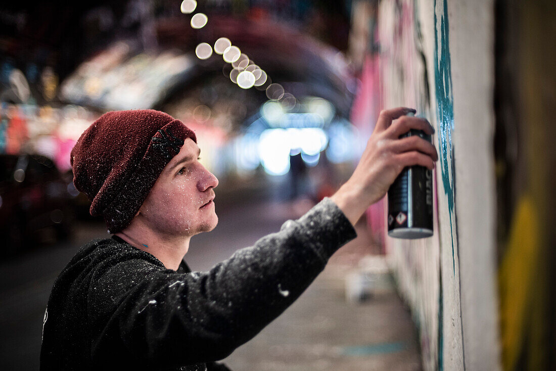 Graffiti artist at Waterloo Leake Street Graffiti Tunnels in central London, England, United Kingdom