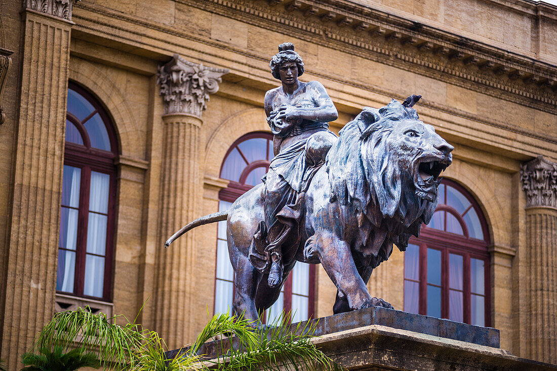 Teatro Massimo, One of two bronze lion statues at Teatro Massimo Vittorio Emanuele (Massimo Theatre Opera House) in Piazza Verdi, Palermo, Sicily, Italy, Europe. This is a photo of one of two bronze lion states at Teatro Massimo Vittorio Emanuele (Massimo Theatre Opera House) in Piazza Verdi, Palermo, Sicily, Italy, Europe.