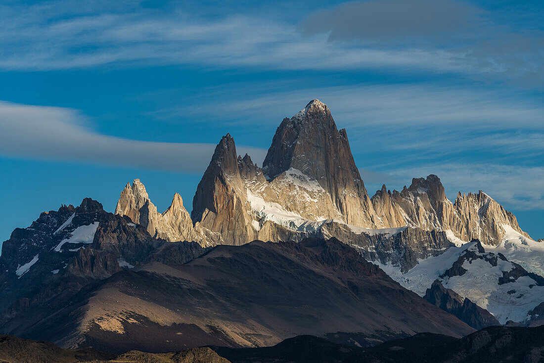 Mottled light and shadow on Mount Fitz Roy in Los Glaciares National Park near El Chalten, Argentina. A UNESCO World Heritage Site in the Patagonia region of South America.