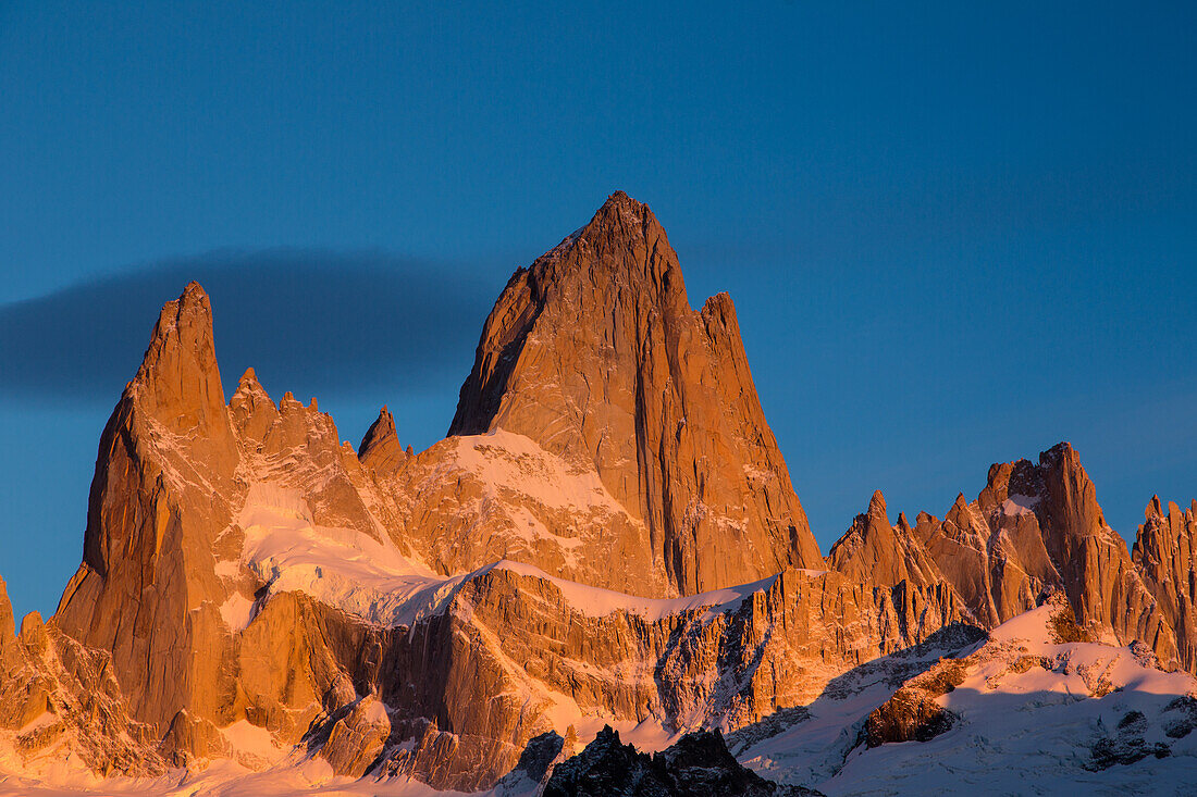 The Fitz Roy Massif at the first light of sunrise. Los Glaciares National Park near El Chalten, Argentina. A UNESCO World Heritage Site in the Patagonia region of South America. Mount Fitz Roy is in the tallest peak in the center.