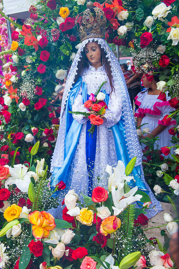 Salvadorian people participate in the procession of the Flower & Palm Festival in Panchimalco, El Salvador