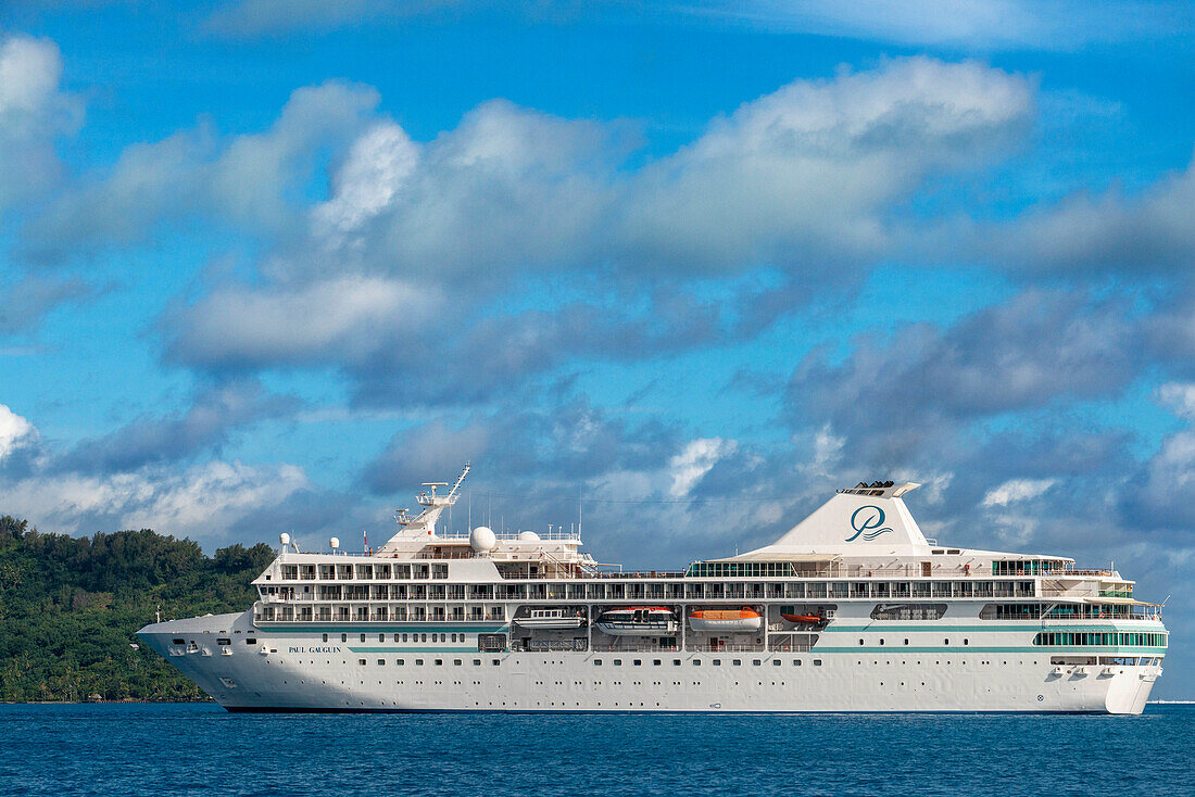 Paul Gauguin cruise anchored in front of Bora Bora Vaitape dock, Society Islands, French Polynesia, South Pacific.