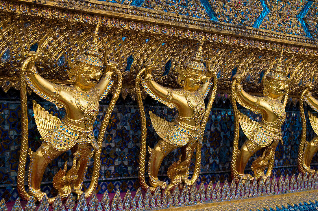 Garuda figures on the ubusot, the main building of Temple of the Emerald Buddha at The Grand Palace in Bangkok, Thailand.