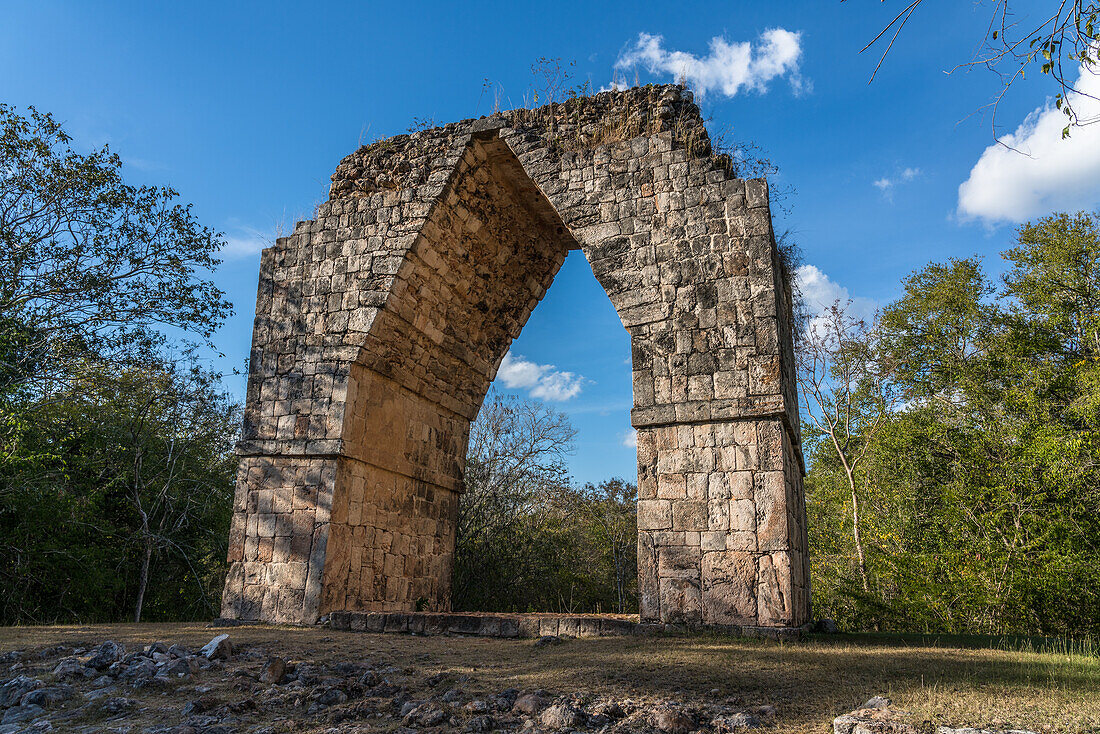 The Arch gateway into the pre-Hispanic Mayan ruins of Kabah are part of the Pre-Hispanic Town of Uxmal UNESCO World Heritage Center in Yucatan, Mexico. The gate was built in early Puuc style.