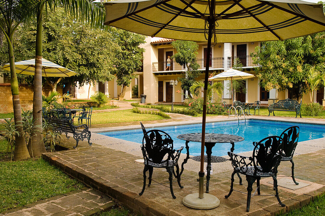 Swimming pool and guest rooms at Hacienda Quinta Minera hotel in the historic town of Cosal?, Sinaloa, Mexico.