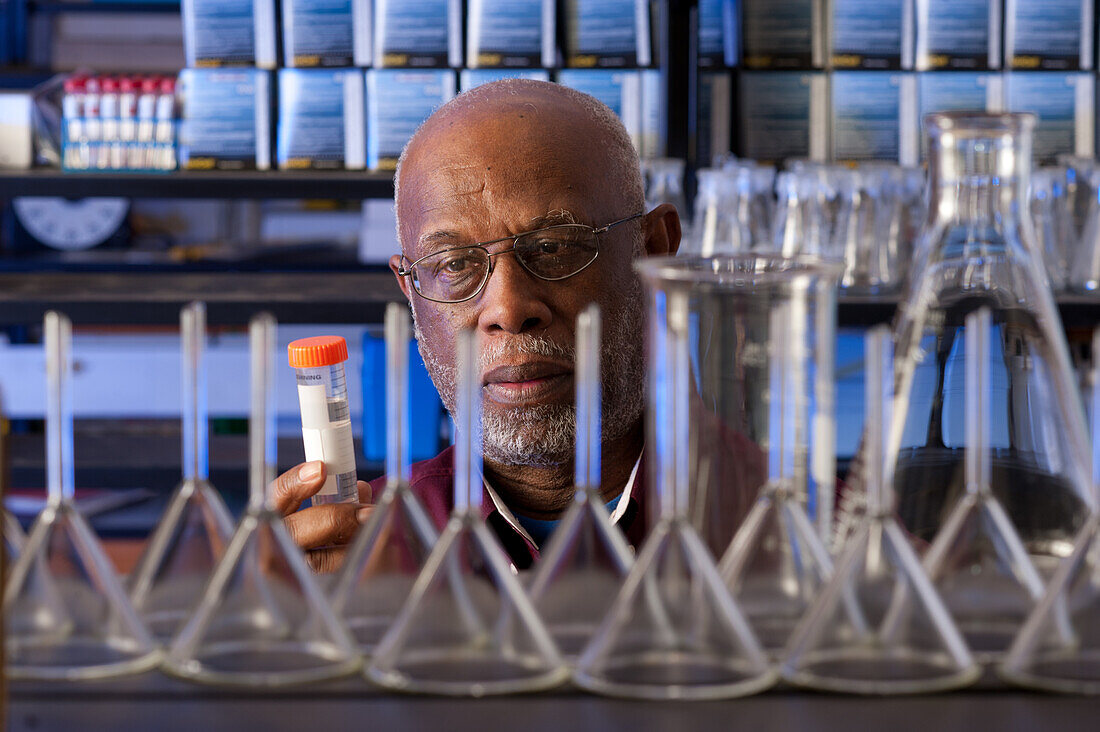 Researcher in a lab studying a sample