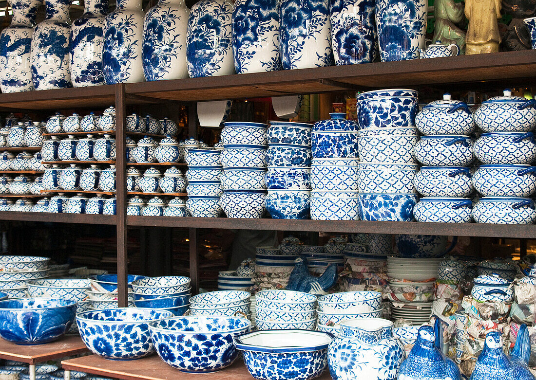 Thai made blue and white ceramic pottery for sale at Chatuchak Weekend Market in Bangkok, Thailand.