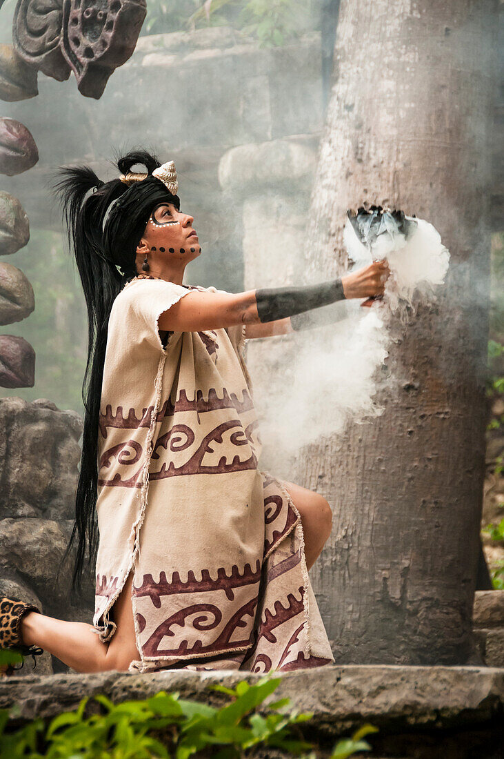 Maya woman performing in Mayan culture show "Los Rostros de Ek chuah" at Xcaret park, Riviera Maya, Mexico.