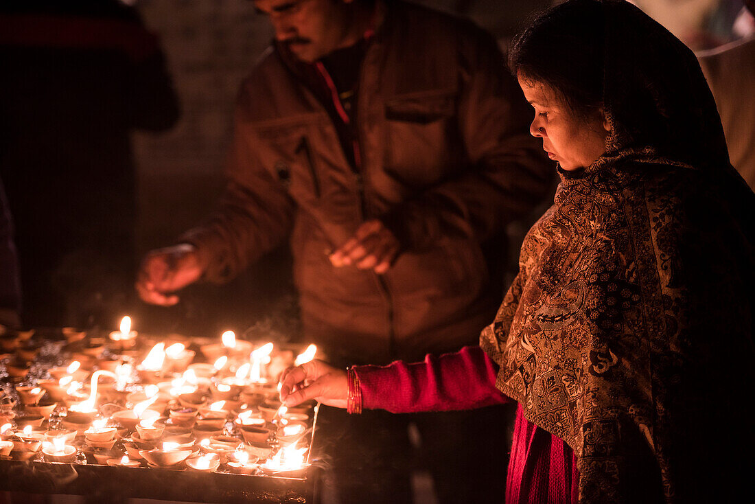 Praying at a Hindu temple in Varanasi, Uttar Pradesh, India