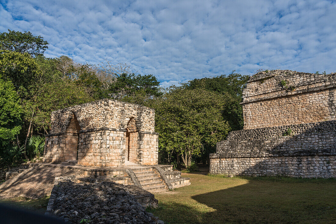 The Entrance Arch in the ruins of the pre-Hispanic Mayan city of Ek Balam in Yucatan, Mexico. Behind the arch is Structure 17 or the Twins, with the Oval Palace to the right.