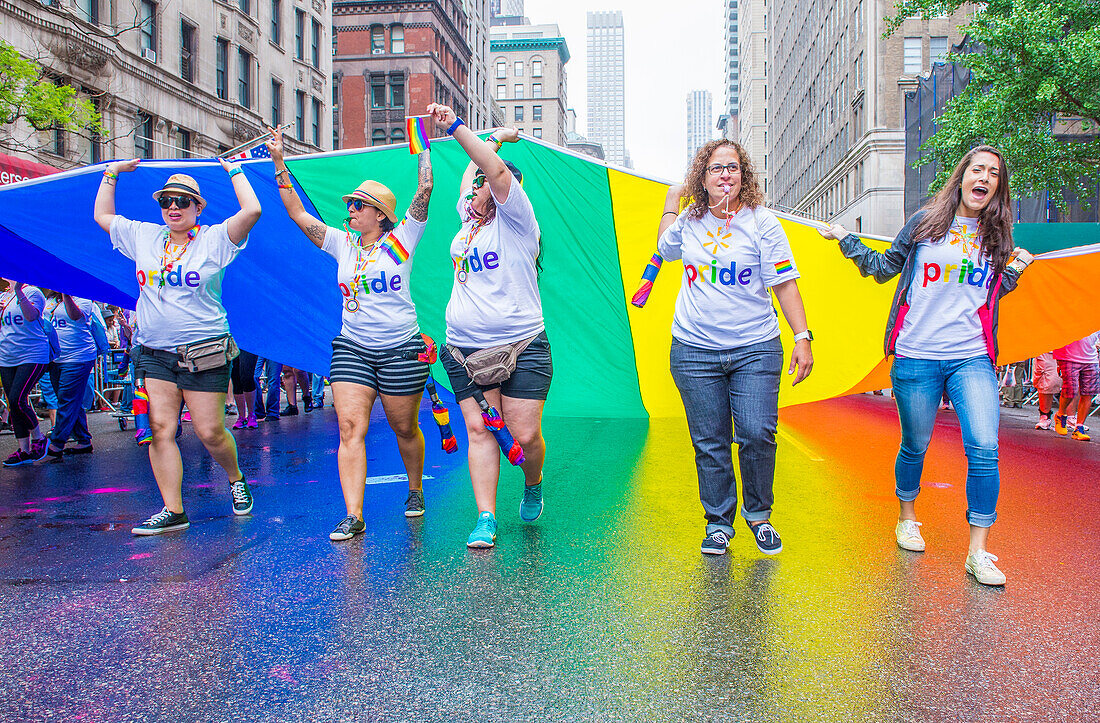 Participants march in the Gay Pride Parade in New York City. The parade is held two days after the U.S. Supreme Court's decision allowing gay marriage in the U.S.