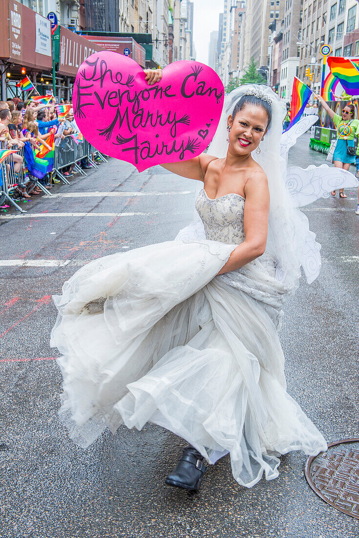 Participant march in the Gay Pride Parade in New York City. The parade is held two days after the U.S. Supreme Court's decision allowing gay marriage in the U.S.