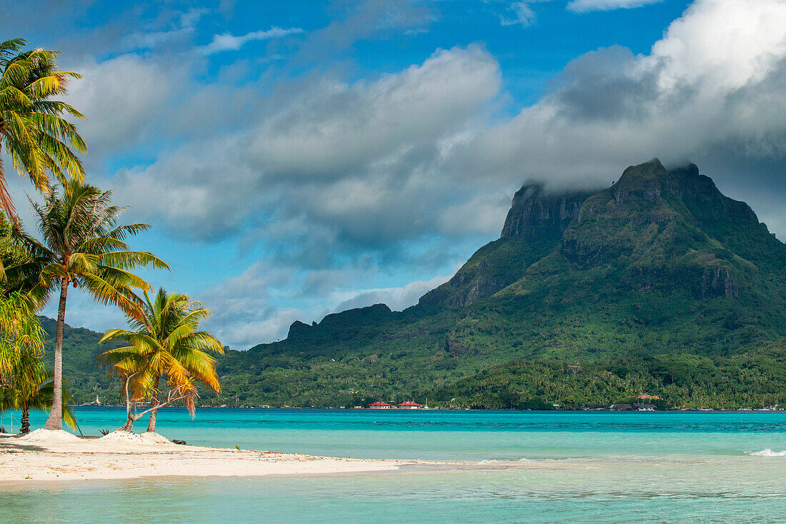 Beach of motu Tevairoa island, a little islet in the lagoon of Bora Bora, Society Islands, French Polynesia, South Pacific.