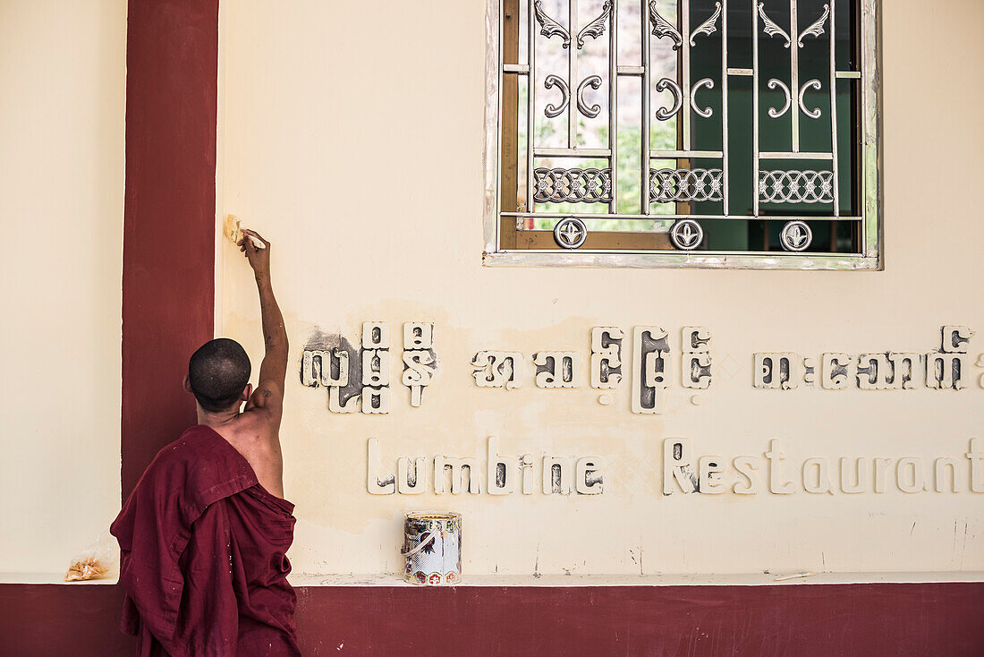 Monk painting at Mount Zwegabin, Hpa An, Kayin State (Karen State), Myanmar (Burma)