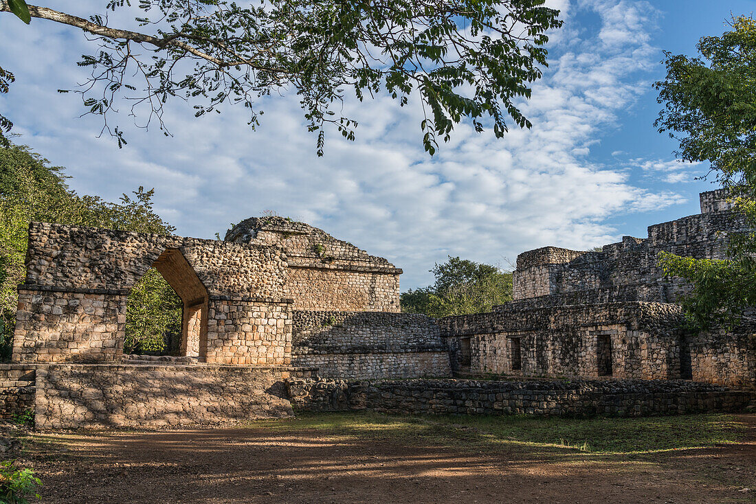 The Entrance Arch in the ruins of the pre-Hispanic Mayan city of Ek Balam in Yucatan, Mexico. Behind the arch is Structure 17 or the Twins, with the Oval Palace to the right.