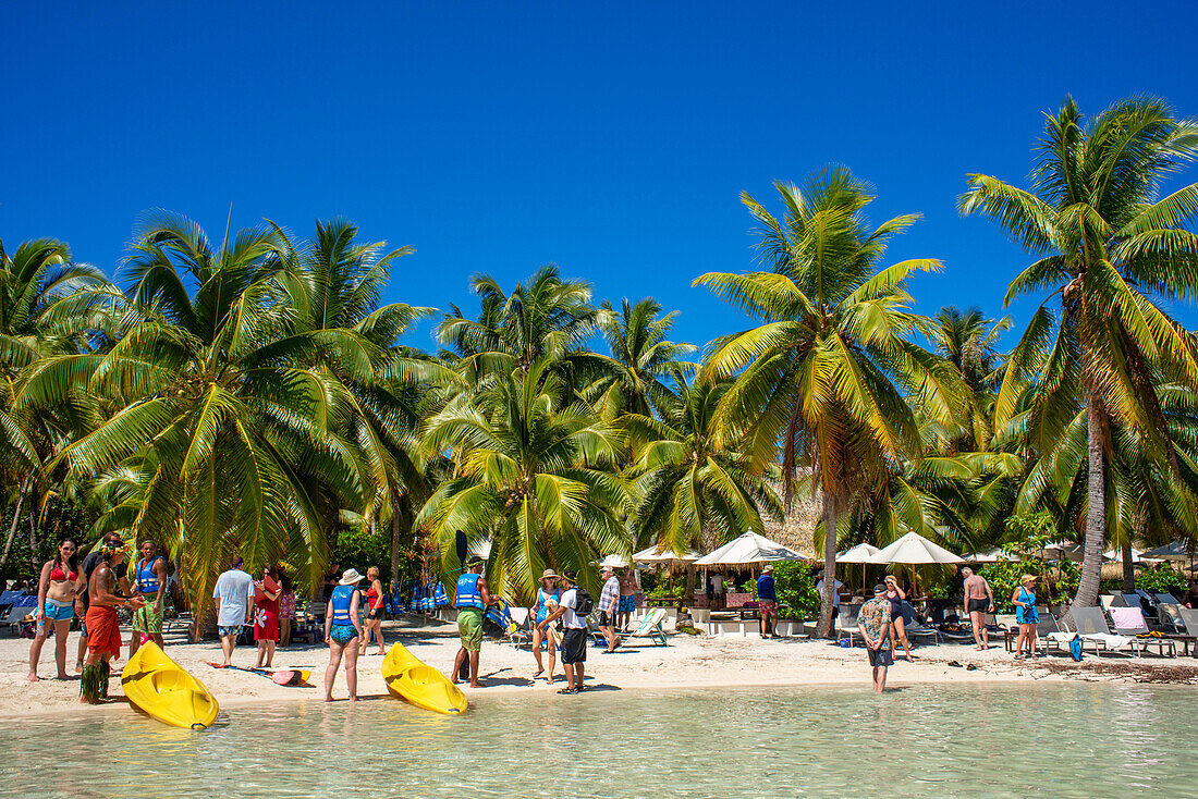 Kayaking in Taha'a island beach, French Polynesia. Motu Mahana palm trees at the beach, Taha'a, Society Islands, French Polynesia, South Pacific.