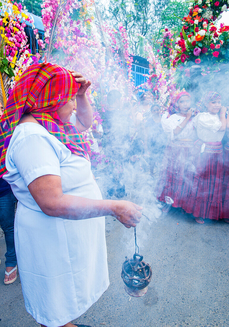 Salvadorian people participate in the procession of the Flower & Palm Festival in Panchimalco, El Salvador