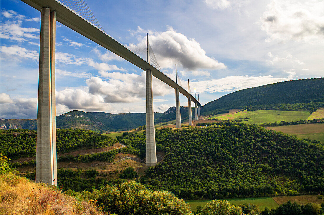 Aerial view Millau viaduct by architect Norman Foster, between Causse du Larzac and Causse de Sauveterre above Tarn, Aveyron, France. Cable-stayed bridge spanning the Tarn River Valley. A75 motorway, built by Michel Virlogeux and Norman Foster, located between Causses de Sauveterre and Causses du Larzac above Tarn River, Natural Regional Park of Grands Causses.