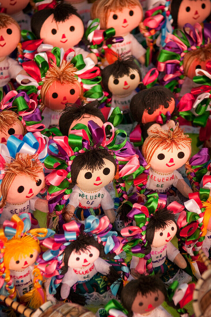 Souvenir dolls for sale by street vendor in Guanajuato, Mexico.