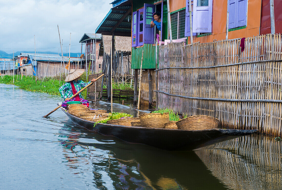 Intha woman on her boat in Inle lake Myanmar on September 07 2017 , inle Lake is a freshwater lake located in Shan state