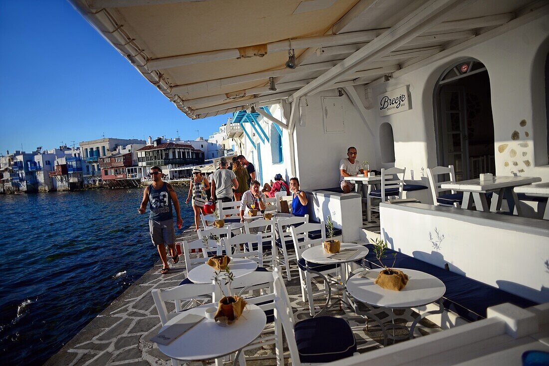 Cafe terrace with Little Venice in view, Mykonos, Greece