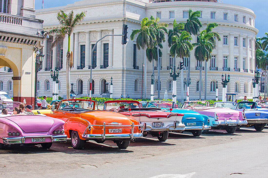 Old classic American cars on one of Havana's Cuba streets. There is nearly 60,000 vintage American cars in Cuba