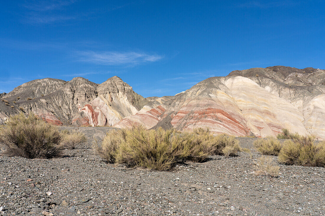 Colorful striped mineral deposits in the hills along the Calingasta Valley in San Juan Province, Argentina.
