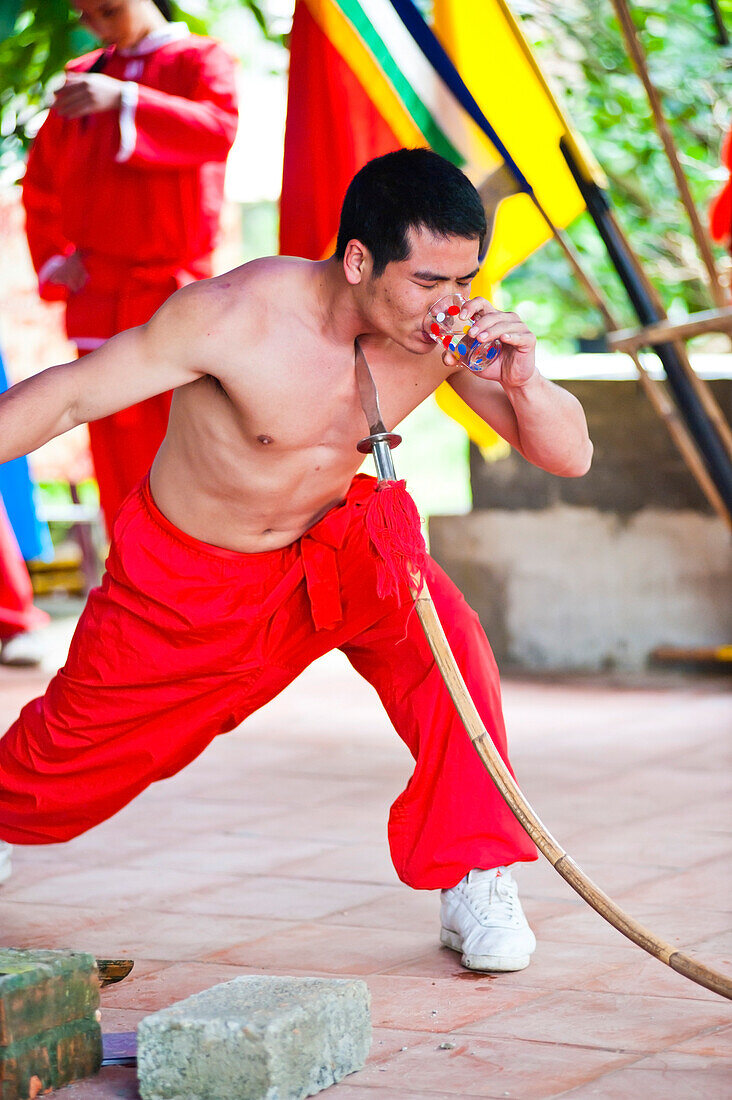 Tourist Performance in Hue, Vietnam. Hue is a historical city in central Vietnam famous for UNESCO World Heritage Site listed imperial city (Dai Noi) and the tombs of old emperors such as the Tomb of Tu Duc and the Tomb of Khai Dinh.