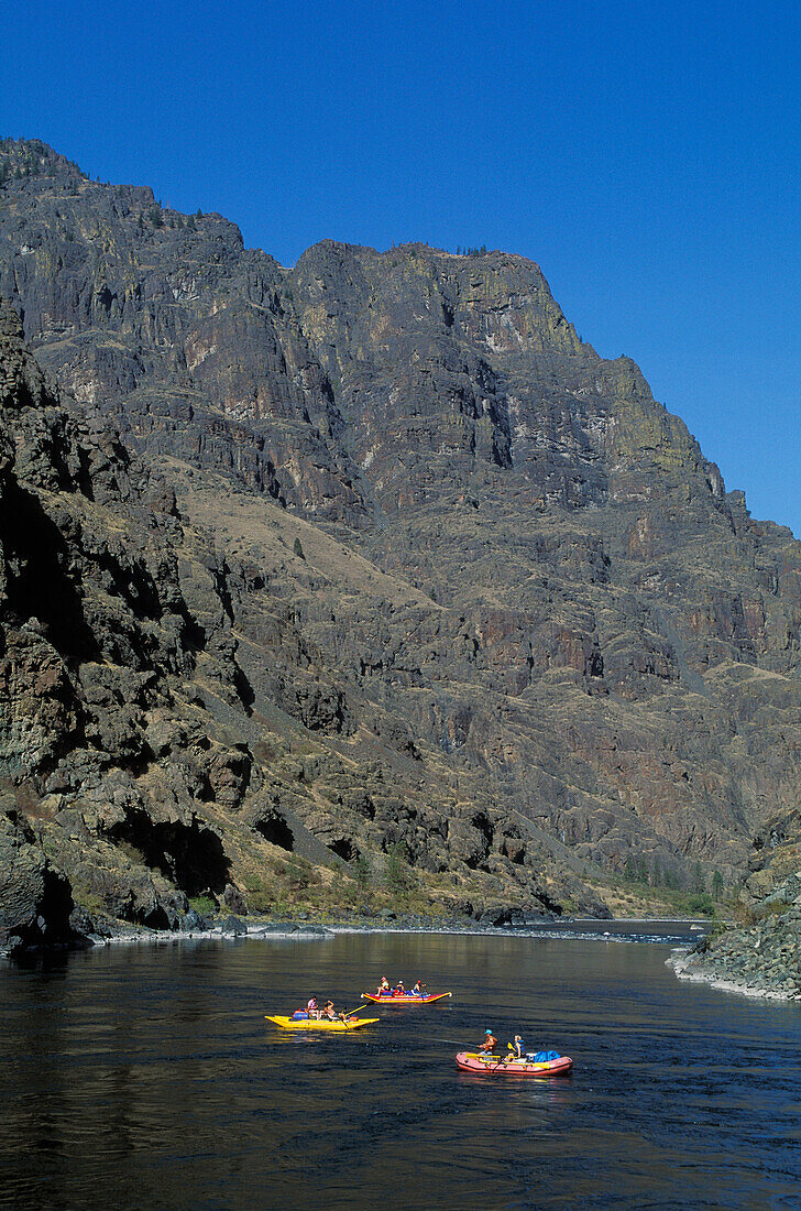 Rafters and fisherman in inflatable boats on Snake River, Hells Canyon National Recreation Area, Oregon-Idaho border.