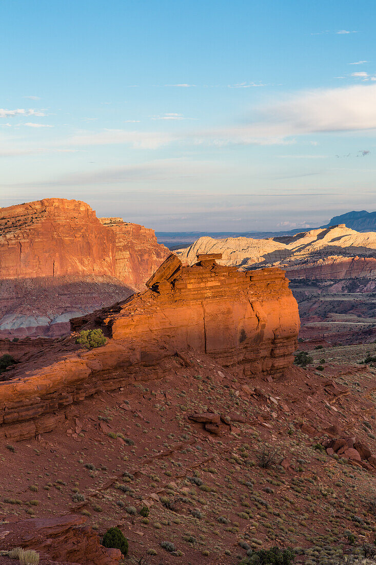 Sunset light on the formations of Capitol Reef National Park, viewed from Sunset Point on the edge of Sulpur Creek Canyon.