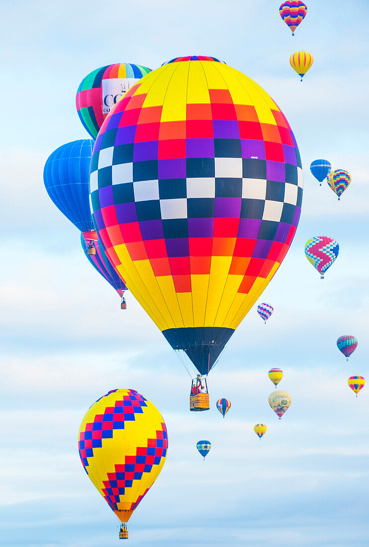 Balloons fly over Albuquerque , New Mexico during Albuquerque balloon fiesta. It’s the biggest balloon event in the the world.