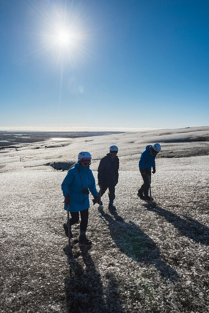 Tourists walking on Breidamerkurjokull Glacier, Vatnajokull Ice Cap, Iceland