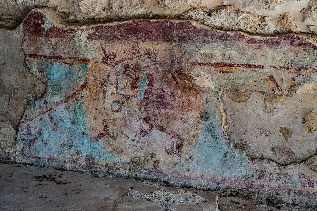 A painted fresco in the Room of the Frescos at the base of the Pyramid of Kukulkan in the ruins of the Post-Classic Mayan city of Mayapan, Yucatan, Mexico.