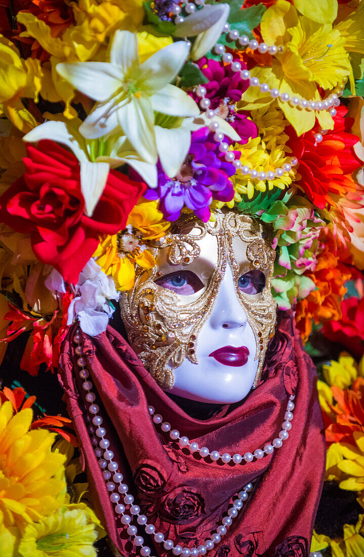 Performer with Venetian style mask at the Carnival experience festival in the Venetian Hotel in Las Vegas