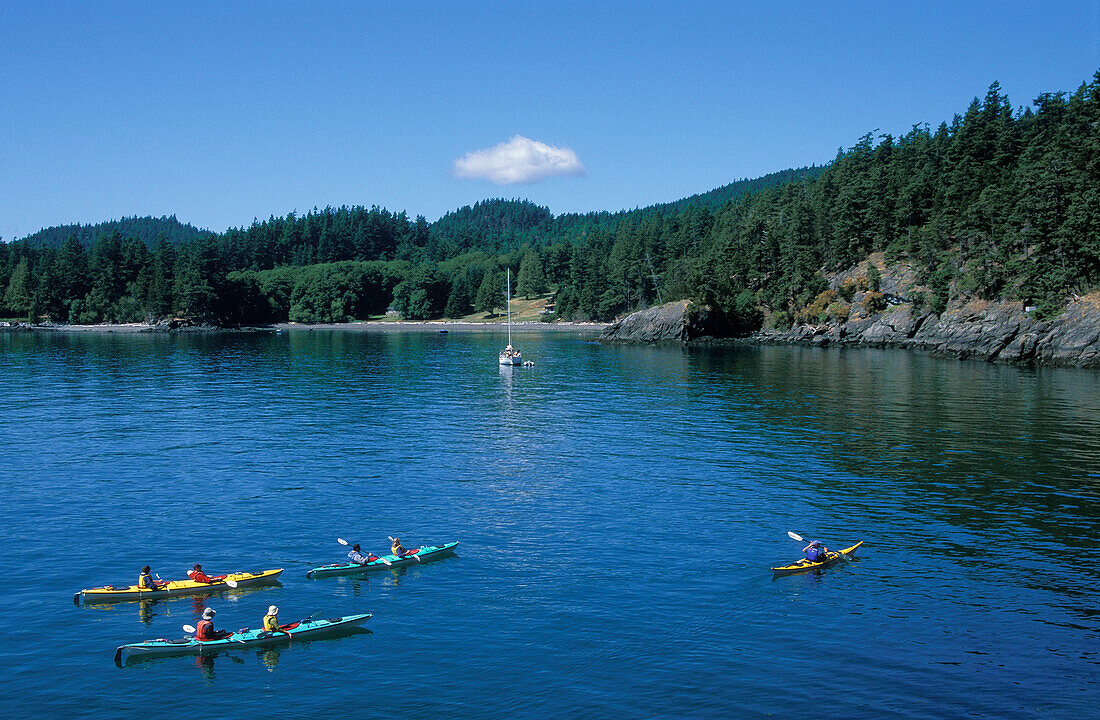 Sea kayaking at Doe Bay on Orcas Island; San Juan Islands, Washington.