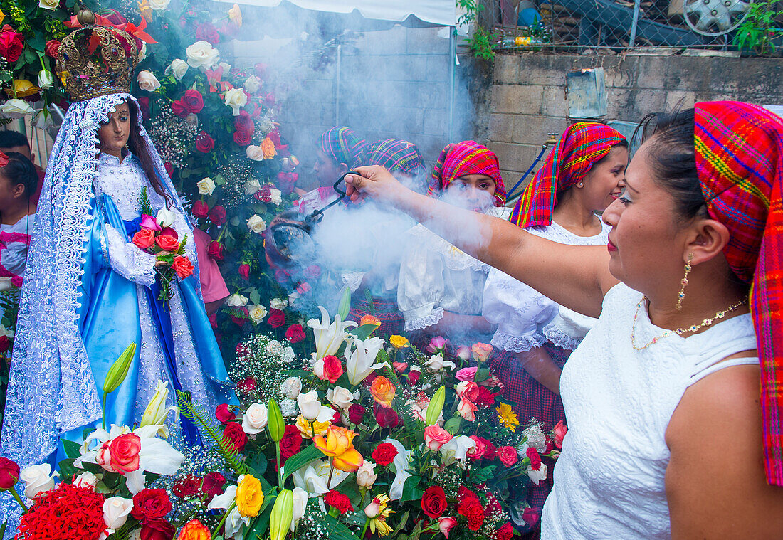 Salvadorian people participate in the procession of the Flower & Palm Festival in Panchimalco, El Salvador