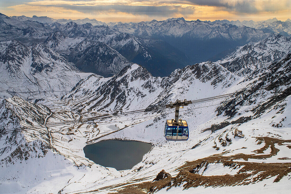 La Mongie lake of Oncet and a cable car rising to The Observatory Of Pic Du Midi De Bigorre, Hautes Pyrenees, Midi Pyrenees, France
