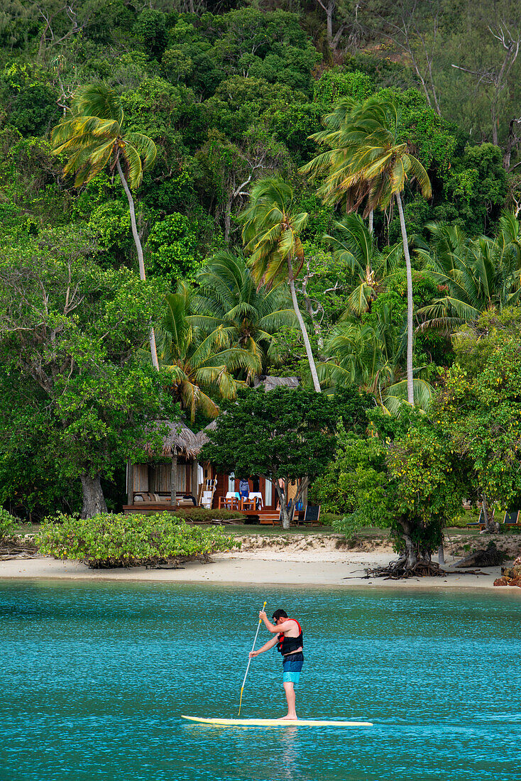 Torust practicing paddel surf in Likuliku Lagoon Resort, Five Star Resort, Malolo Island, Mamanucas, Fiji
