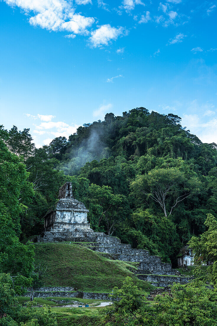 Low clouds in the morning at the Temple of the Cross in the ruins of the Mayan city of Palenque, Palenque National Park, Chiapas, Mexico. A UNESCO World Heritage Site.