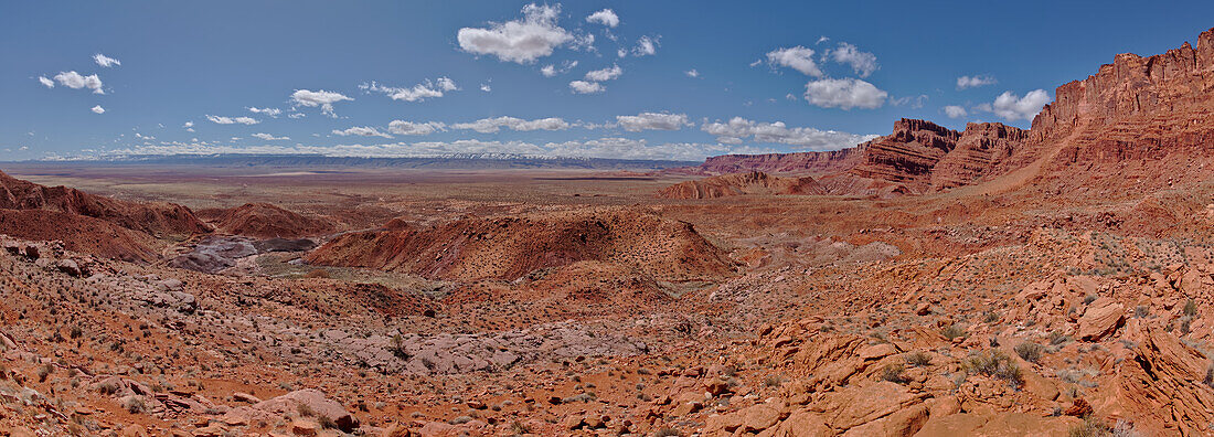 Panorama view from above Sand Hill Spring at Vermilion Cliffs National Monument, with snow covered land in the distance of the Kaibab Plateau, location of the Grand Canyon, Arizona, United States of America, North America