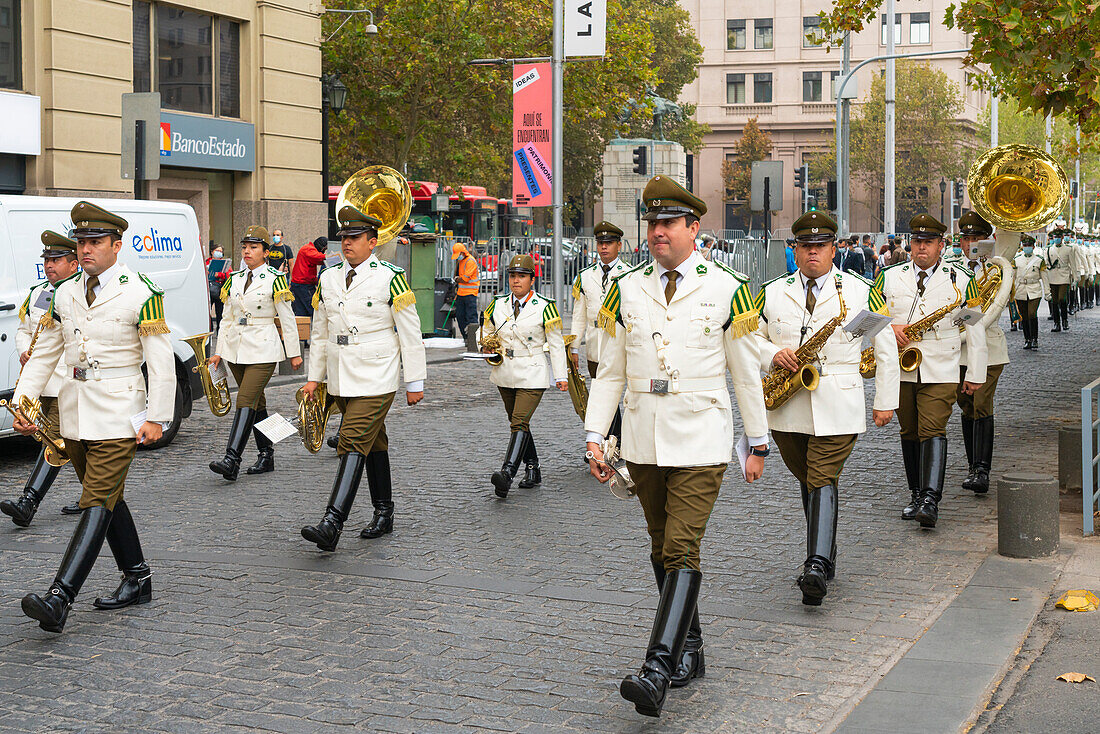 Policemen marching to La Moneda Palace for changing of guards ceremony, Santiago, Santiago Metropolitan Region, Chile, South America