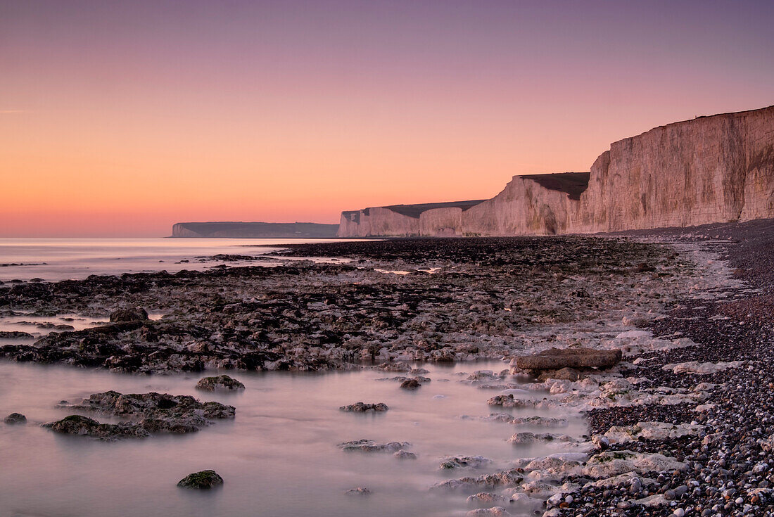 The Seven Sisters white chalk cliffs at sunset, Birling Gap, South Downs National Park, East Sussex, England, United Kingdom, Europe