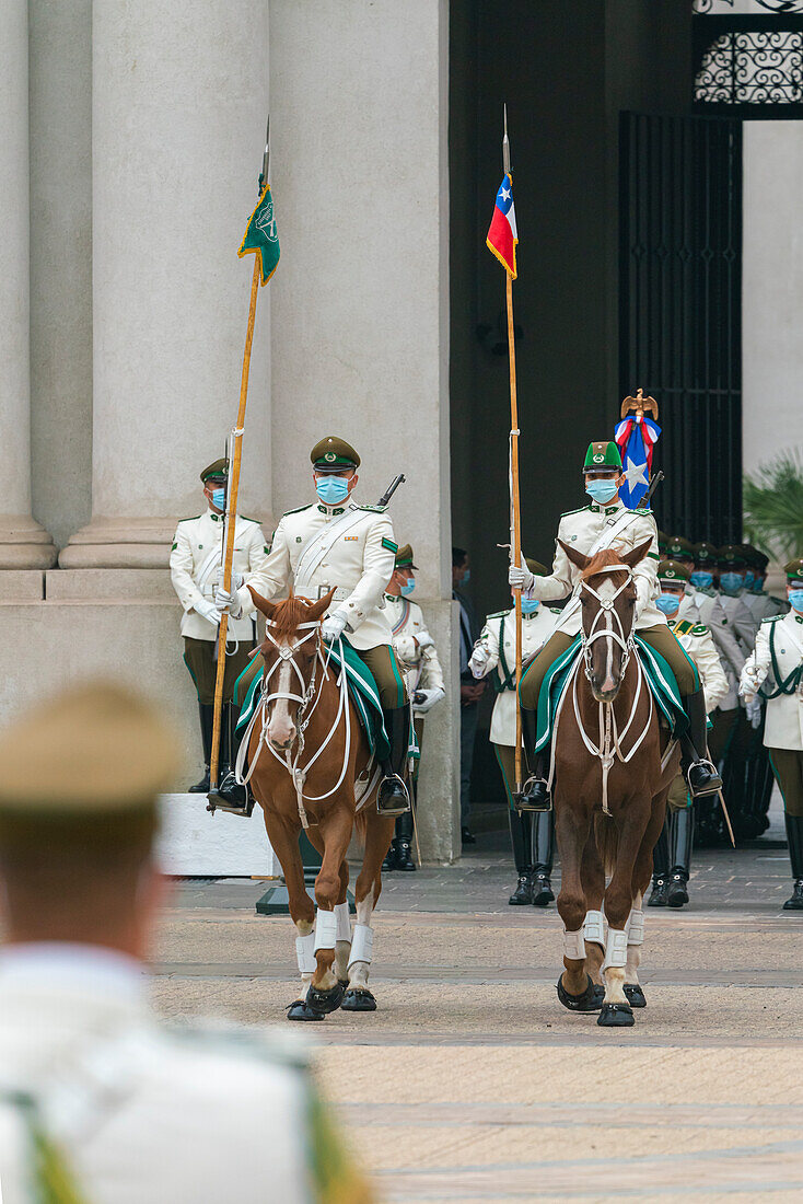 Policemen performing changing of guards ceremony in front of La Moneda Palace, Santiago, Santiago Metropolitan Region, Chile, South America