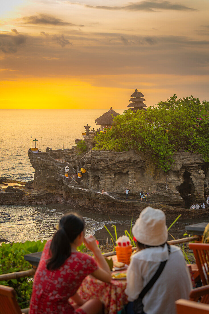 Tourists at Tanah Lot, traditional Balinese temple at sunset, Beraban, Kediri, Tabanan Regency, Bali, Indonesia, South East Asia, Asia