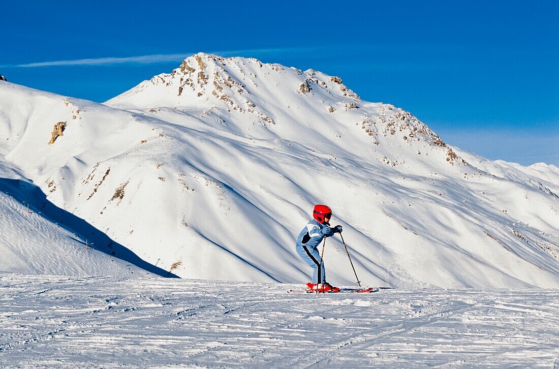 Child Skiing In Mountains